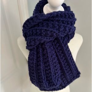 Handmade chunky knit scarf in deep royal purple. Approx 60” x 8”.